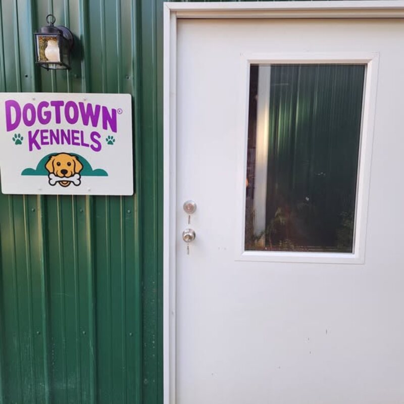 The Dogtown Kennels sign beside the office door